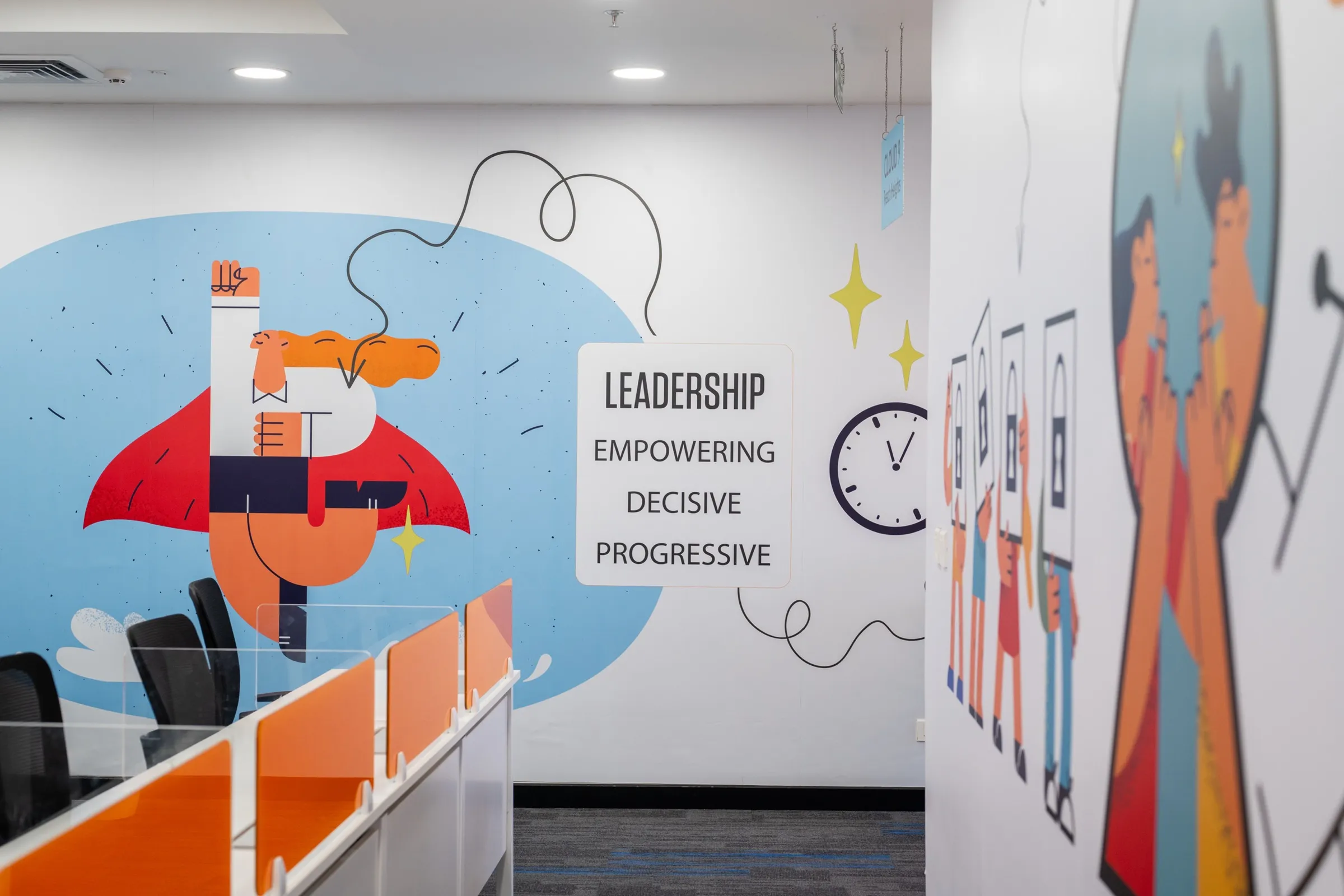 Close-up of the "Leadership" illustrated mural above the workstations